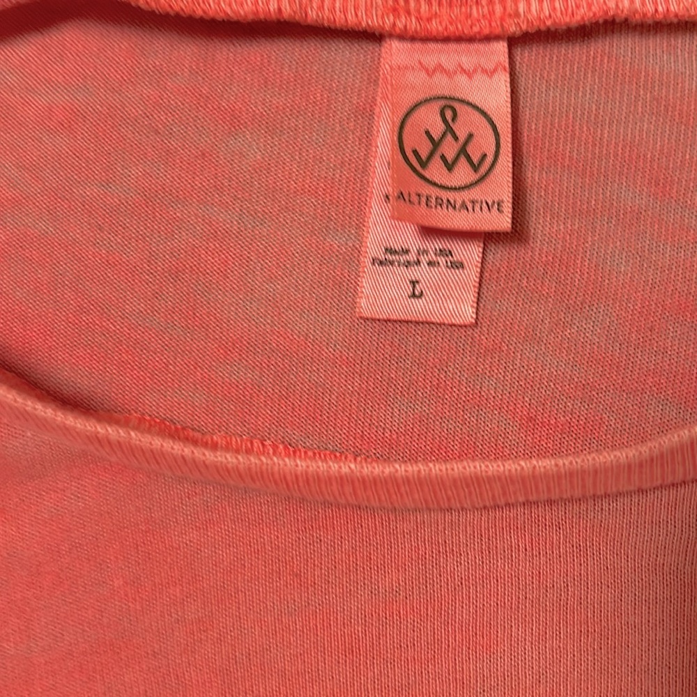 Fun salmon colored! I bought but never wore